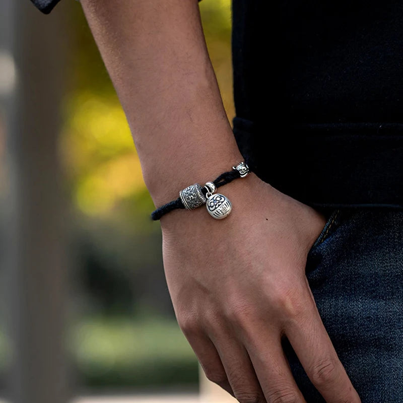 Schwarzes tibetisches Kupfer-Charm-Armband