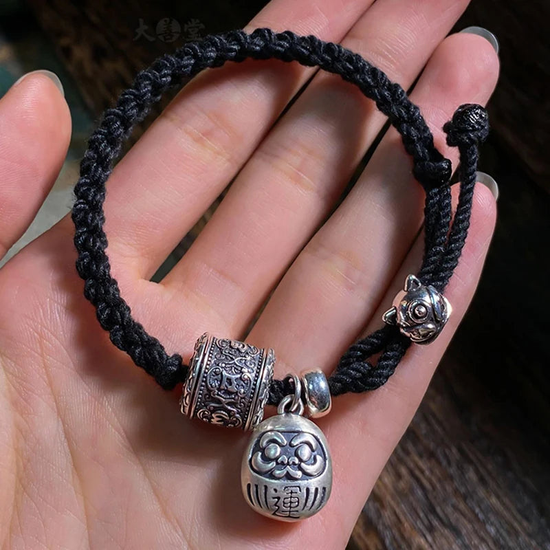 Schwarzes tibetisches Kupfer-Charm-Armband