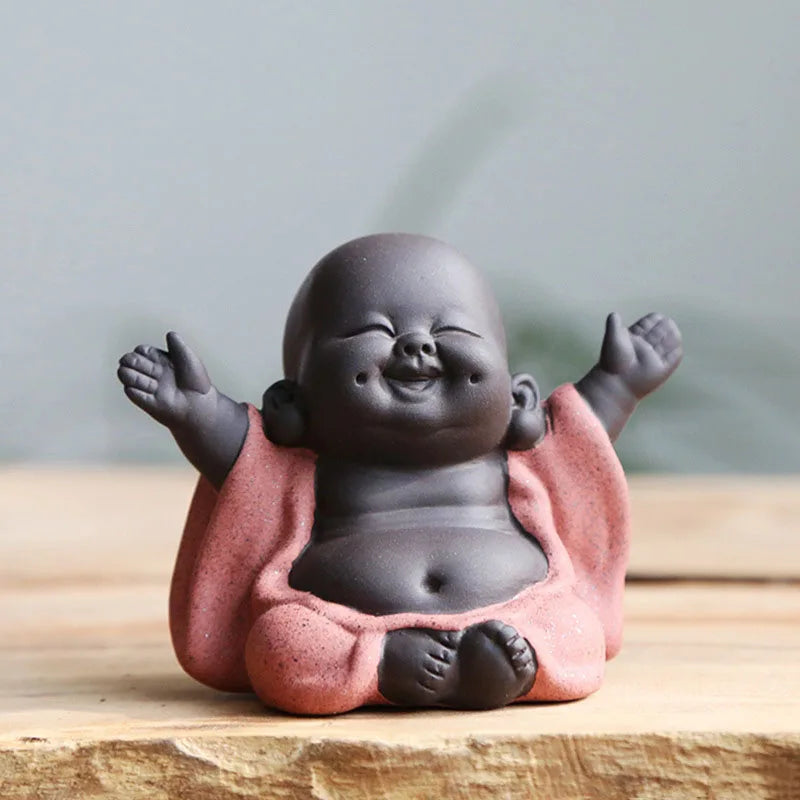 Estatuilla de Buda bebé riendo