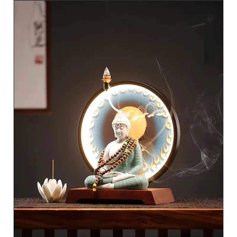 Breloque tête de Bouddha en métal argenté. Autres modèles au choix Breloque tête de Bouddha en métal argenté. Autres modèles au choix