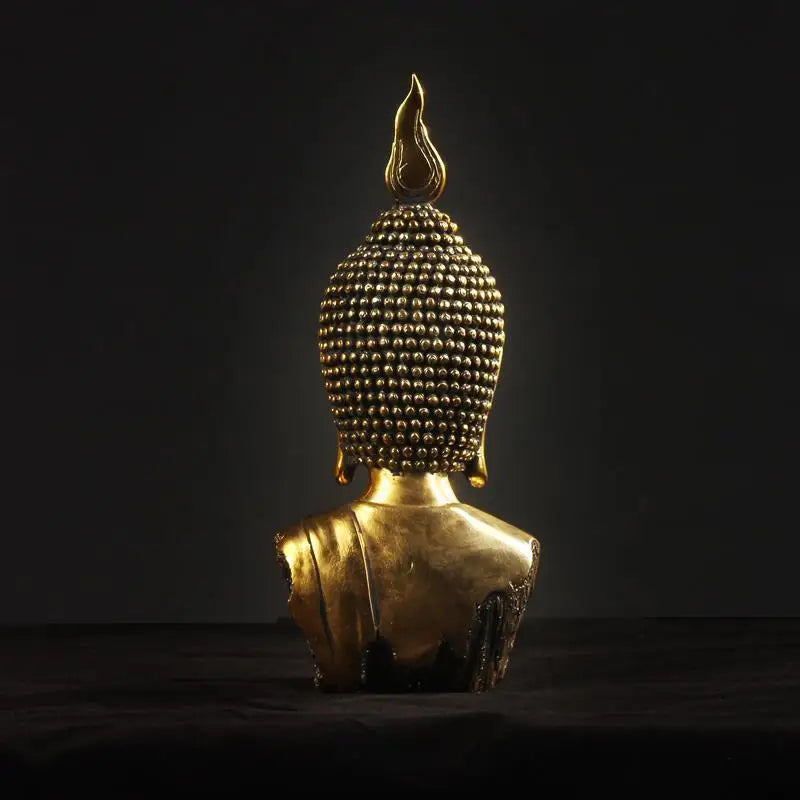 Statue de tête de Bouddha dorée