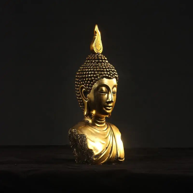 Statue de tête de Bouddha dorée